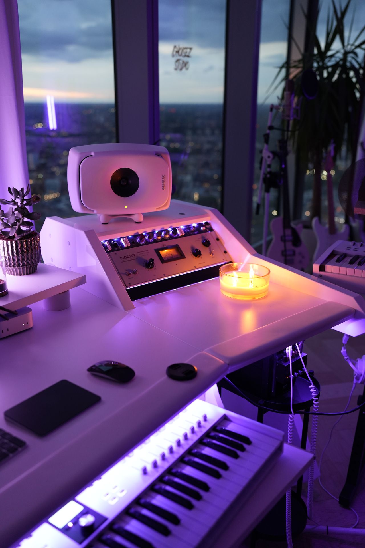 Studio keyboard, monitor and candlelight at the London production studio